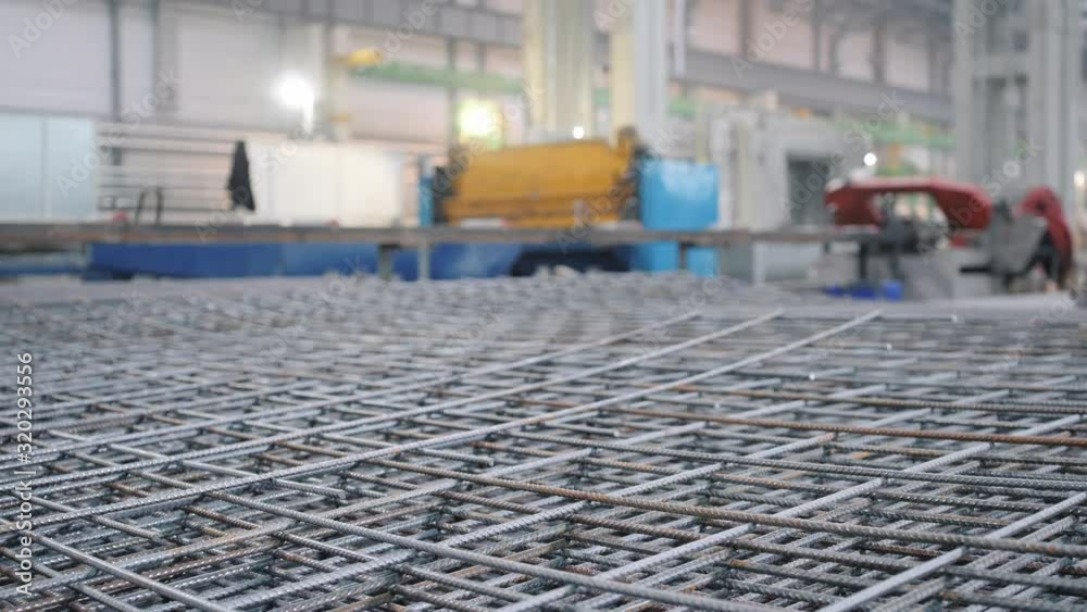large metal rebar mold pile lies at concrete panel production factory
