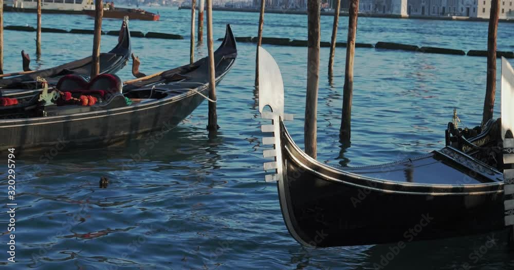 Medieval Gondola Docked in Major Busy Venice Canal Medieval Gondola Docked in Major Busy Venice Canal