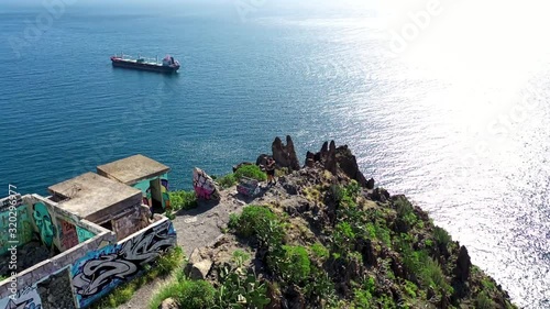 man and weoman near by a cliff photo