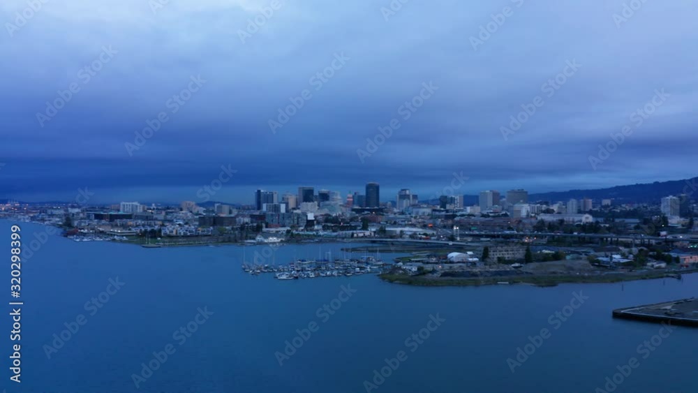 Daybreak at dawn with the sunrise over the bay and urban city. Daybreak at dawn with the sunrise over the bay and urban city.