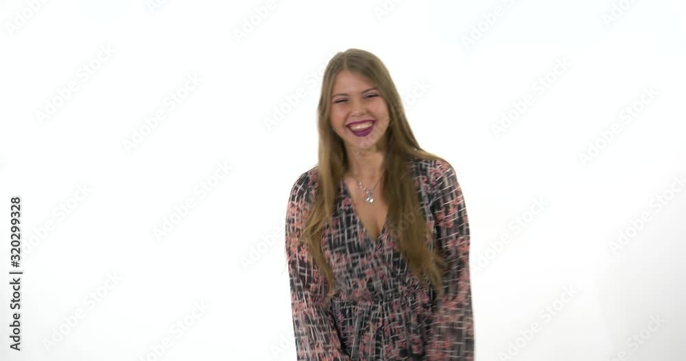 Beautiful Young Girl Clapping Sarcastically, thumbs up smiling and playing with hair. Beautiful Young Girl Clapping Sarcastically, thumbs up smiling and playing with hair.
