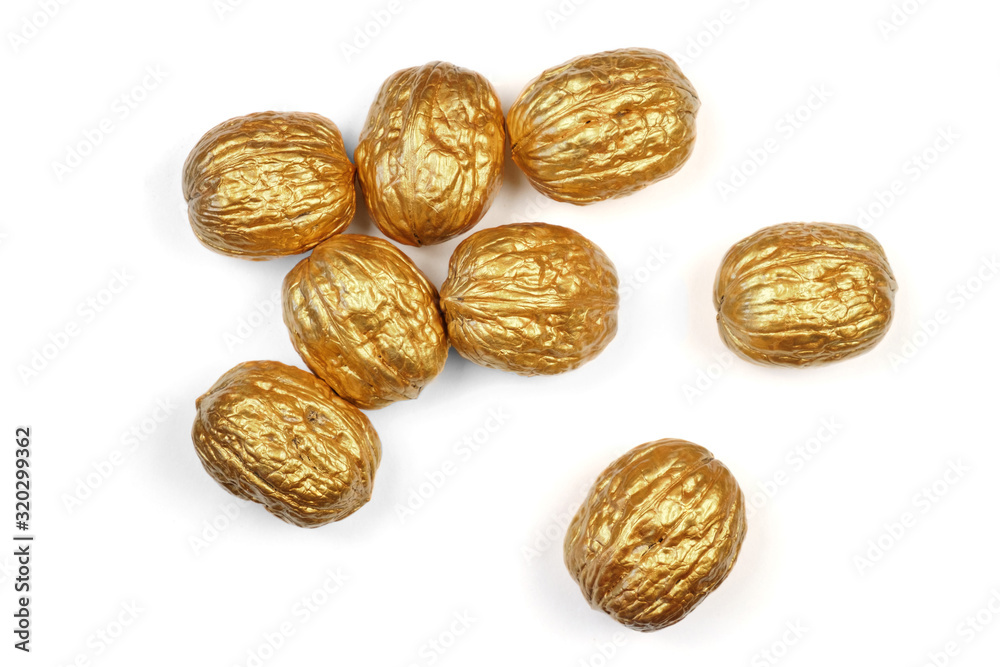Golden walnuts on a white background
