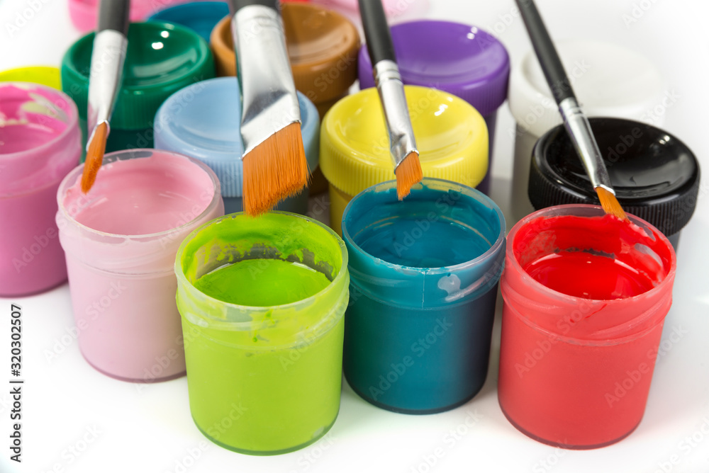 Details of colorful school paints and brushes Details of colorful school paints and brushes