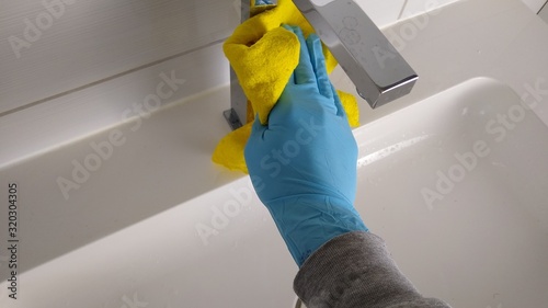 Household - cleaning the bathroom - cleaning - home cleaning - hand with yellow rag