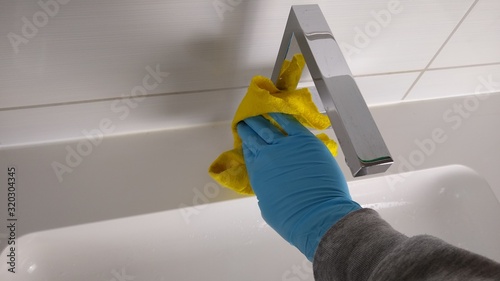 Household - cleaning the bathroom - cleaning - home cleaning - hand with yellow rag