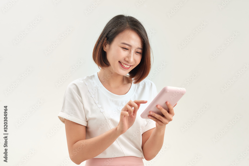 young woman with calculator, isolated on white background young woman with calculator, isolated on white background