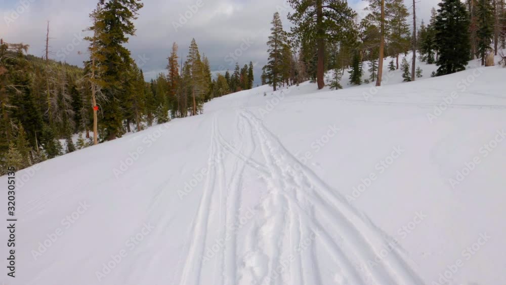 POV shot of a snowboarder riding through a ski resort POV shot of a snowboarder riding through a ski resort