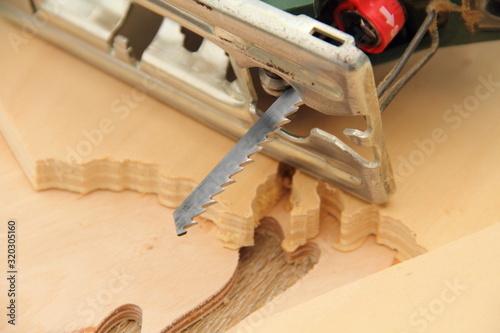 a jigsaw with sawn wood