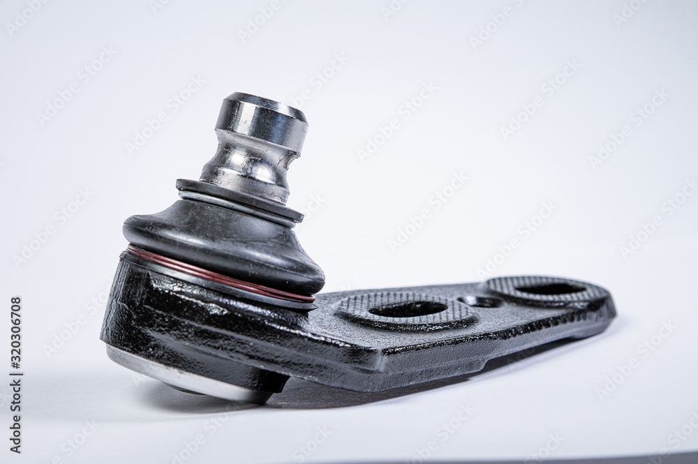Obraz premium New spare parts spherical ball joints of a suspension bracket of a car on a gray background