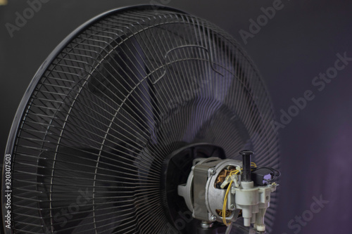 Close-up motor fan Repair and maintenance of home appliances for fixing the fan, nut and wire copper roll of motor fan on black background