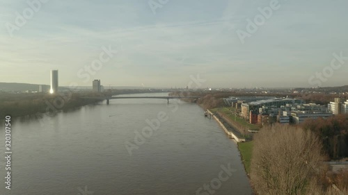 Wallpaper Mural Cinematic drone / aerial shot of the river rhine in bonn königswinter with the post tower the Kameha Grand Hotel and the konrad adenauer bridge at the golden hour afternoon, 24p Torontodigital.ca