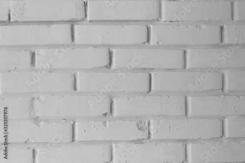 Texture of a brick wall, whitewashed with white paint. architecture.