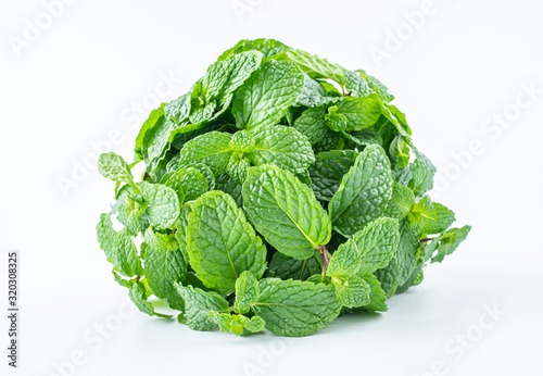 A handful of fresh spice mint leaves on white background