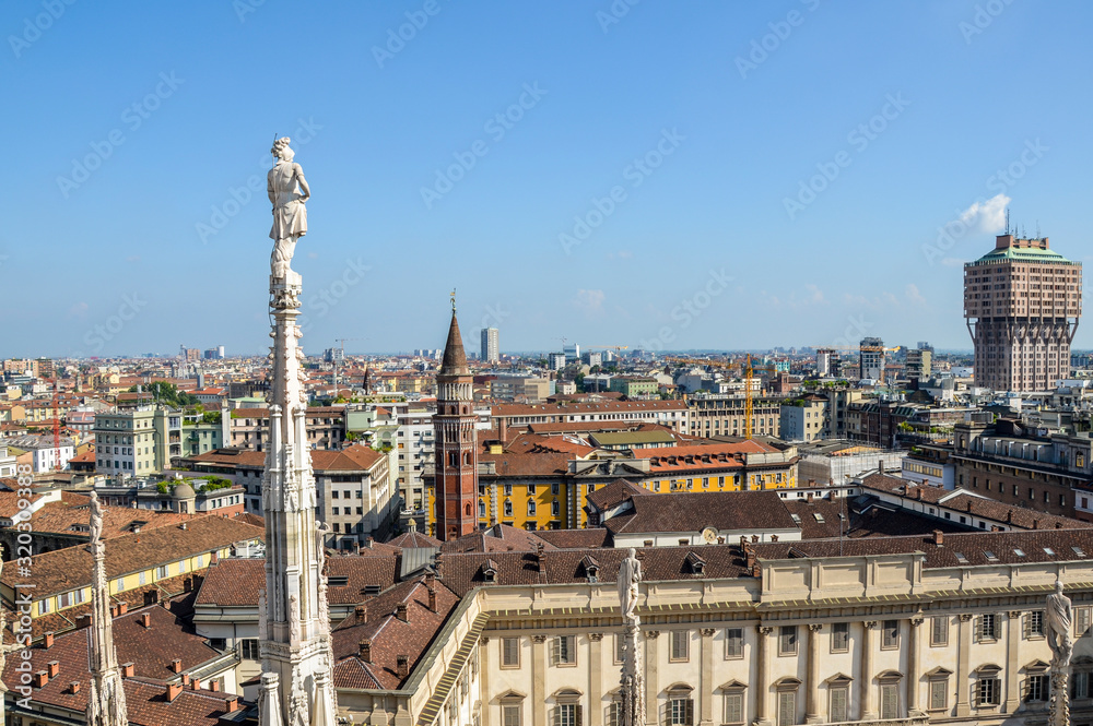 Aerial view of Milan from Duomo roof terrace, Italy. Visible Tower Velasca and Bell Tower in Saint Gottardo in Corte, Italy 