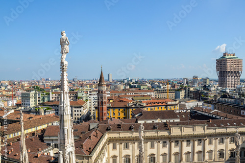 Aerial view of Milan from Duomo roof terrace, Italy. Visible Tower Velasca and Bell Tower in Saint Gottardo in Corte, Italy  © Dmytro