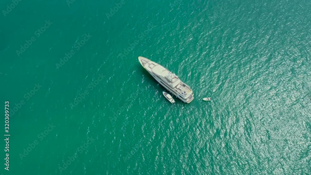 Luxury ship sailing tranquil sea. Aerial view of yacht racing sea bay Luxury ship sailing tranquil sea. Aerial view of yacht racing sea bay