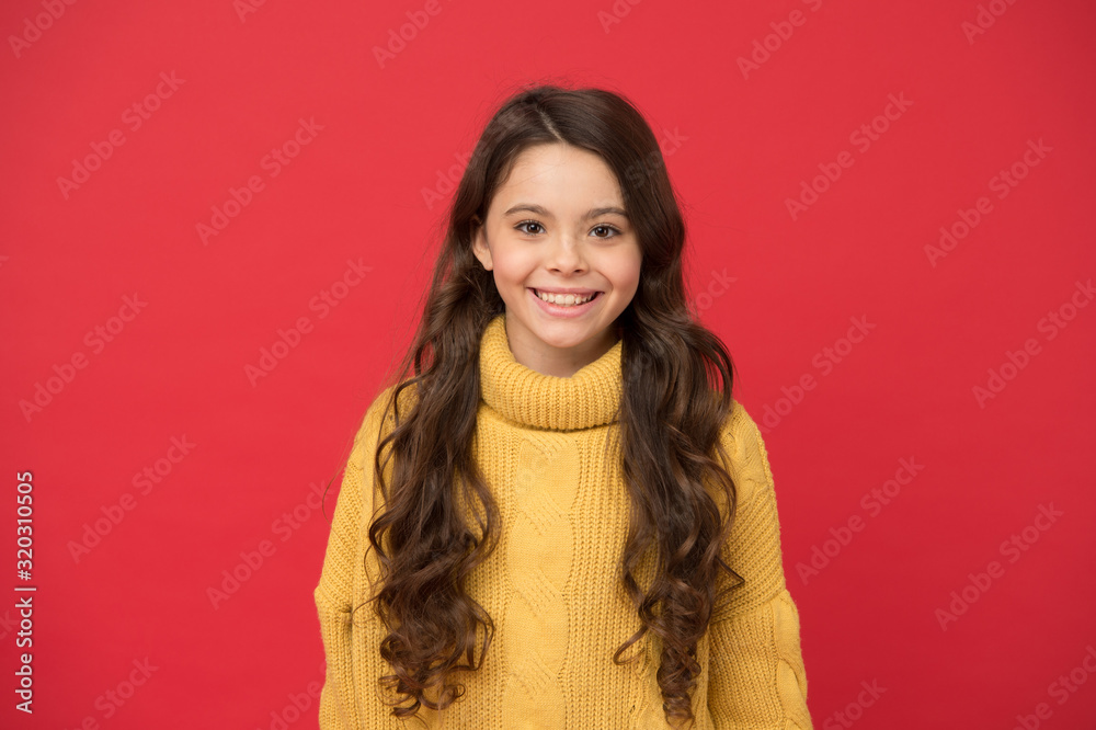 Natural curls. Long lasting effect. Kid cute face adorable curly hairstyle.  Little girl grow long hair. Teen fashion model. Styling curly hair.  Hairdresser tip. Kid girl long healthy shiny hair Stock Photo |