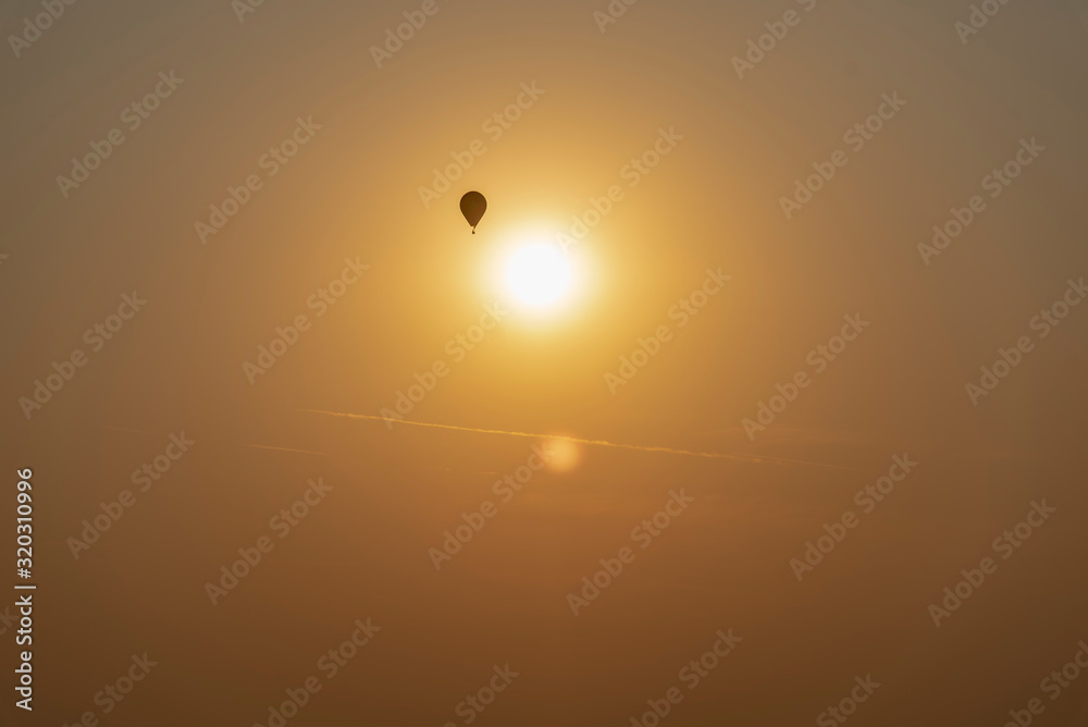 Hot Air Balloon Silhouettes At Sunrise in slovenia Hot Air Balloon Silhouettes At Sunrise in slovenia