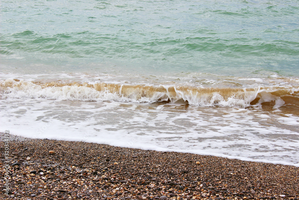 Wave on the beach background texture. Beautiful clear water lapping on the shore. waves on sea coast. Wave on the beach background texture. Beautiful clear water lapping on the shore. waves on sea coast.