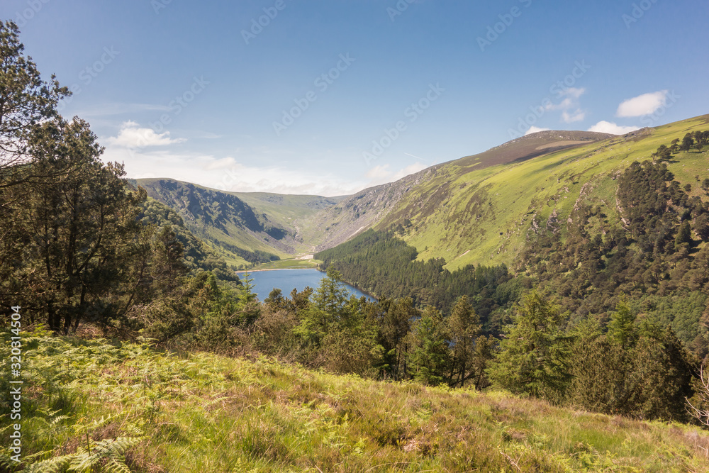 View looking down on the Upper Lake at Glendalough National Park in County Wicklow, Ireland. View looking down on the Upper Lake at Glendalough National Park in County Wicklow, Ireland.