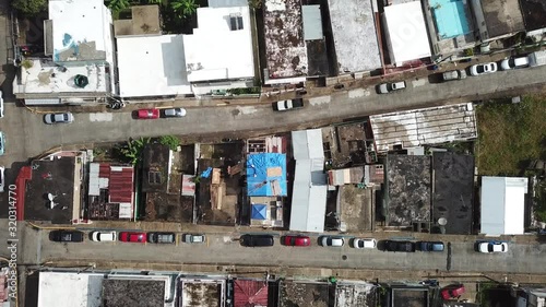 Top Down Aerial View on Reconstruction Work on House in San Juan Neighborhood, Puerto Rico, After Hurricane Maria Disaster photo