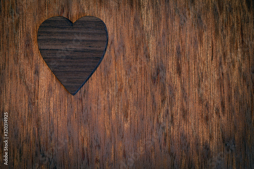 Wooden heart on old wooden background