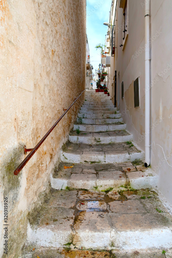 Side street of Ostuni town with staircase, Apulia region, Italy, Adriatic Sea