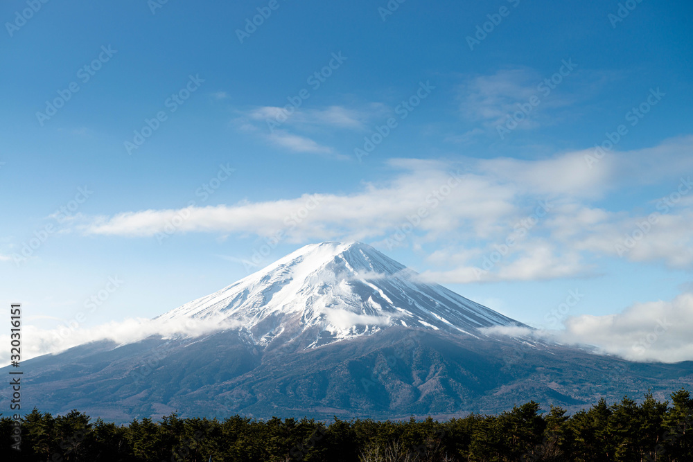 Fuji mountain with snow cover on the top with could, Japan