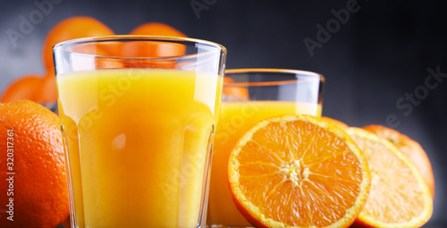 Canvas Print Glasses with freshly squeezed orange juice