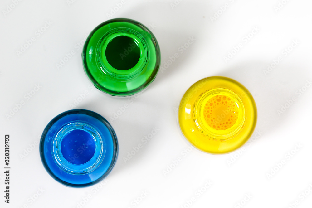 Glass bottle with acrylic green, blue and yellow paint Glass bottle with acrylic green, blue and yellow paint