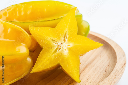 Fresh fruits carambola and pulp slices on white background