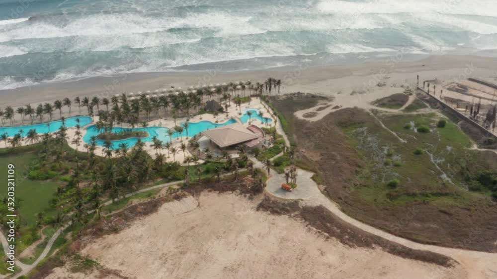 Aerial View of Pool by Sandy Beach With Ocean Waves in Acapulco, Mexico Aerial View of Pool by Sandy Beach With Ocean Waves in Acapulco, Mexico