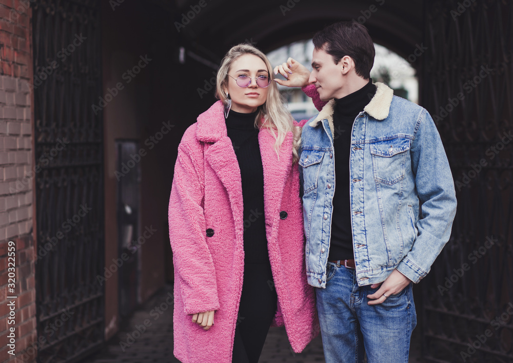 stylish young couple posing in street style stylish young couple posing in street style