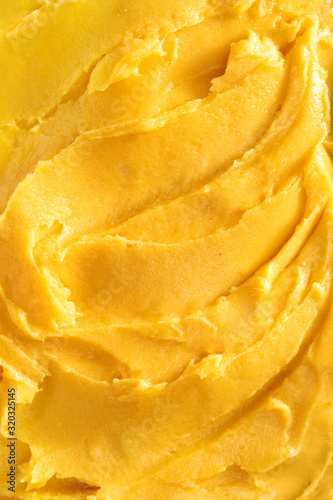 Top view of soft mango sorbet surface photo