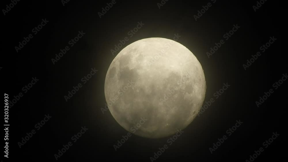 Haunted creepy near full moon with eerie dark clouds moving past in the foreground, perfect for Halloween, scary dark themed, celestial footage. Haunted creepy near full moon with eerie dark clouds moving past in the foreground, perfect for Halloween, scary dark themed, celestial footage.