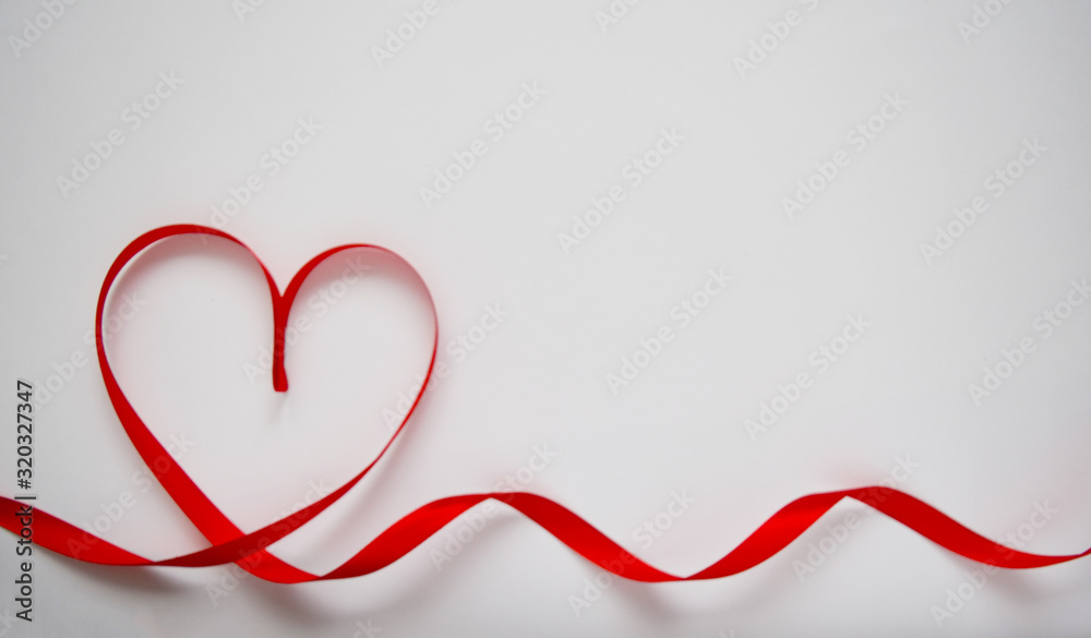 Red heart ribbon bow isolated on white background. Valentines day concept
