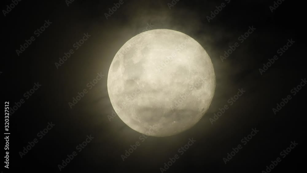 Haunted creepy near full moon with eerie dark clouds moving past in the foreground, perfect for Halloween, scary dark themed, celestial footage. Haunted creepy near full moon with eerie dark clouds moving past in the foreground, perfect for Halloween, scary dark themed, celestial footage.