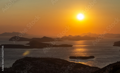The sun sets over a number of Croatian Islands lighting up the Adriatic Sea. Viewpoint as seen from Srd Hill, Dubrovnik.