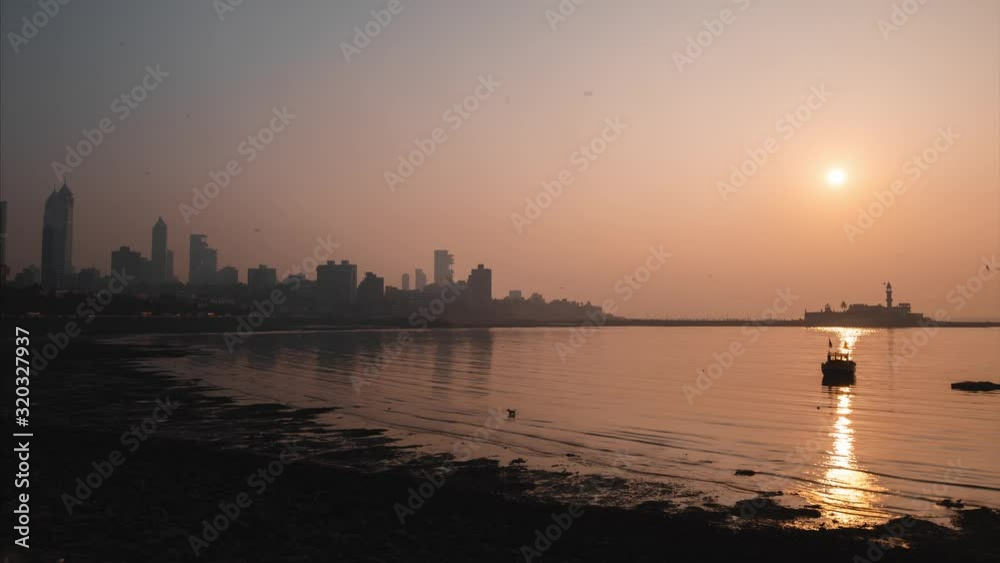 Sun setting over Haji Ali Mosque Dargah and Tardeo Mumbai India Sun setting over Haji Ali Mosque Dargah and Tardeo Mumbai India