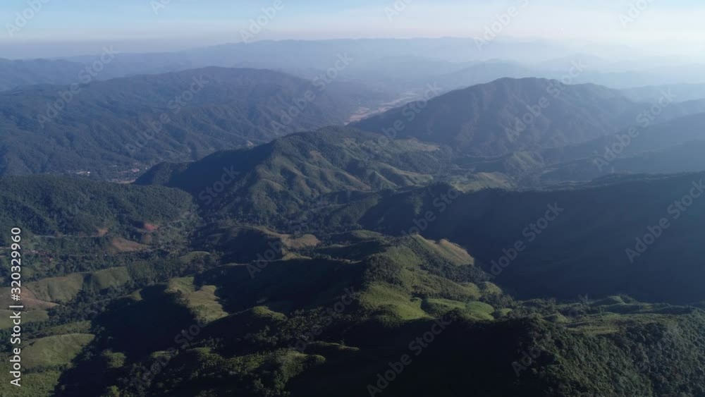 AERIAL High Above Asian Mountain Ranges On A Foggy Morning AERIAL High Above Asian Mountain Ranges On A Foggy Morning