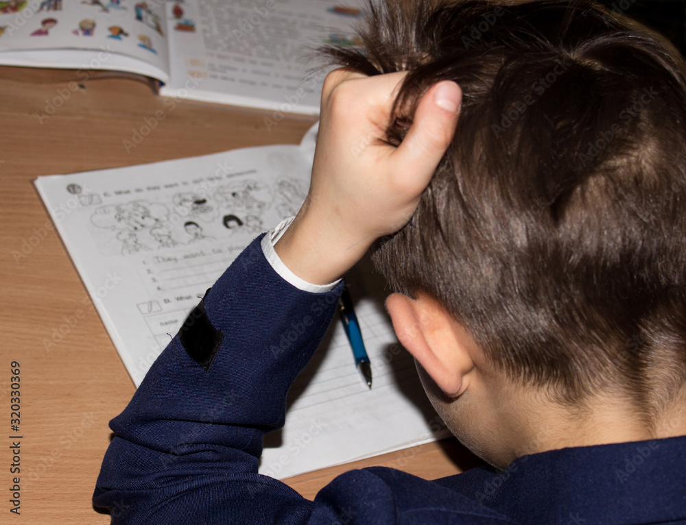 A child after a difficult school assignment A child after a difficult school assignment