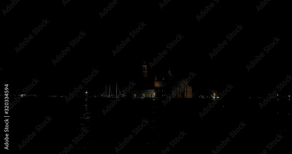 Venice night cityscape. Boat ride with a view of the Church of San Giorgio Maggiore on the small island. Italy Venice night cityscape. Boat ride with a view of the Church of San Giorgio Maggiore on the small island. Italy