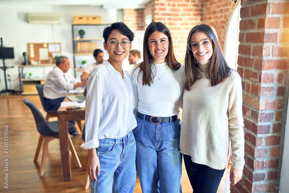 Fototapeta premium Beautiful businesswomen smiling happy. Standing with smile on face speaking taking rest at the office