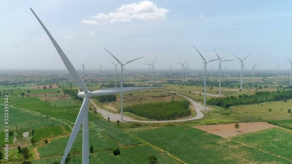 Aerial drone view of wind turbine farm. Green power, environment friendly and renewable energy concept Aerial drone view of wind turbine farm. Green power, environment friendly and renewable energy concept