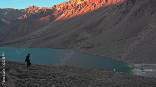 A person walking towards chandratal lake , spiti valley photo