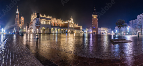 Krakow, Poland, panorama of Main Square with Cloth Hall, St Mary's church and Town Hall tower in the night