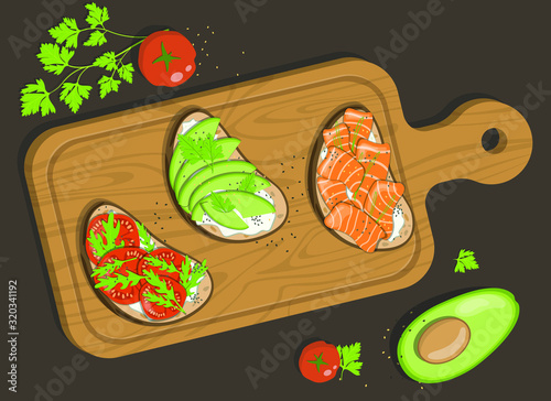 Board with three bruschettas with cottage cheese, red salt fish, avocado, tomatoes and herbs. Near the board lies half an avocado, 2 tomatoes and a branch of parsley.