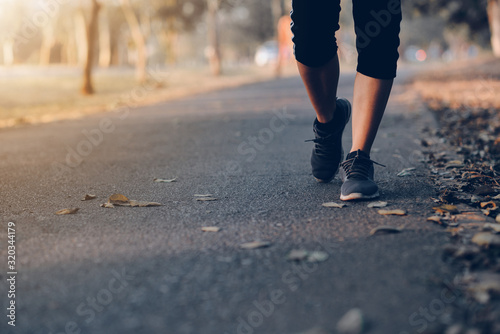 Human running on the park with Close up shoes