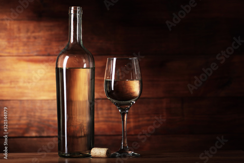 bottle of white wine with a goblet