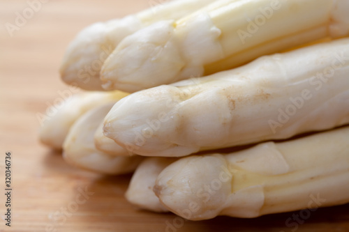 New harvest of white asparagus vegetable in spring season , washed white asparagus ready to cook, spring menu for restaurants